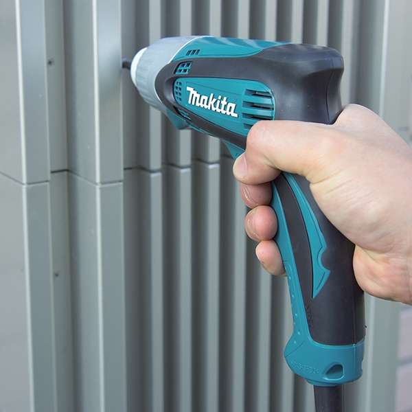 Makita TD0100(110V) impact driver fastening into a metal wall panel