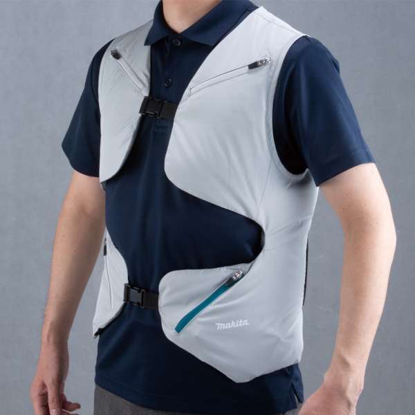 A worker wearing the Makita DFV214A01 cordless fan vest