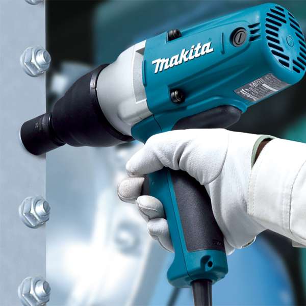 Gloved worker fastening structural steel bolts with the Makita TW0350(110V) impact wrench