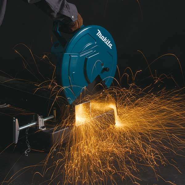 Makita LW1401S portable cut-off saw cutting square steel tubing with sparks