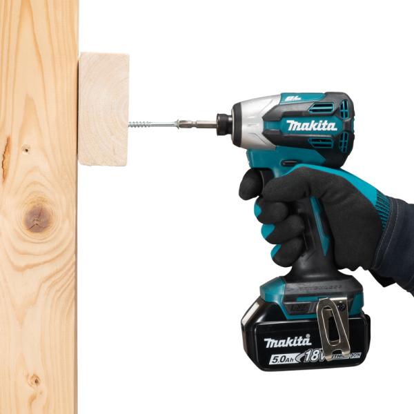 Makita DTD158Z impact driver used one-handed to drive a long screw into wood
