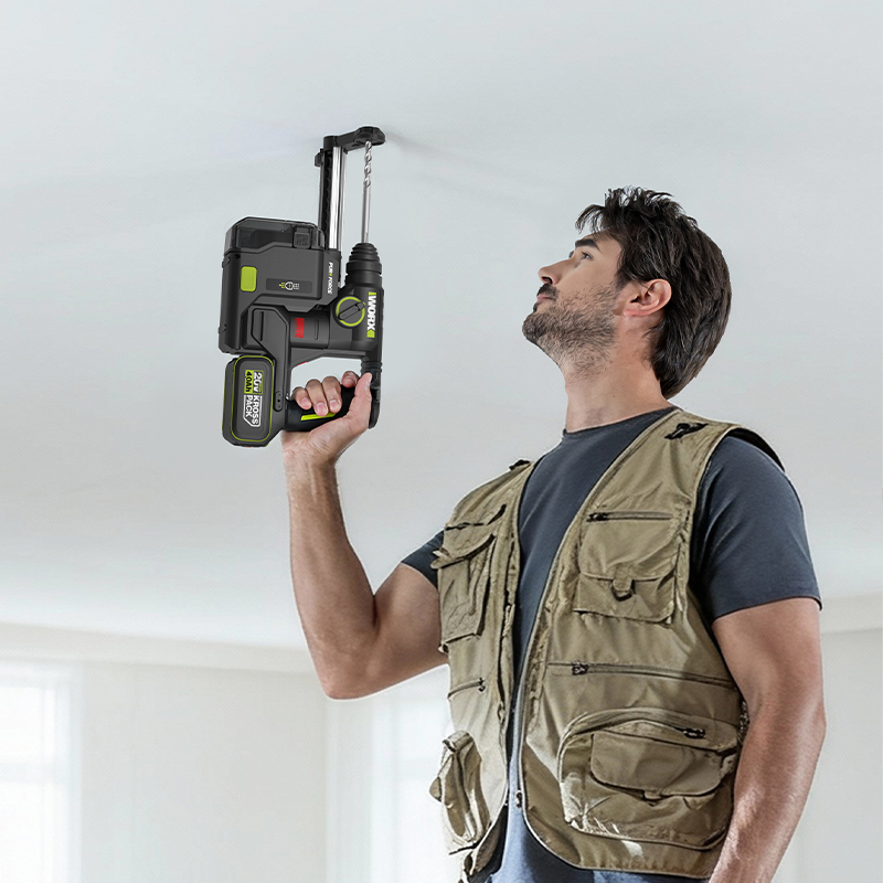 WORX WU384 20V brushless rotary hammer drilling a ceiling one-handed (shown with the optional WA1603 dust box)