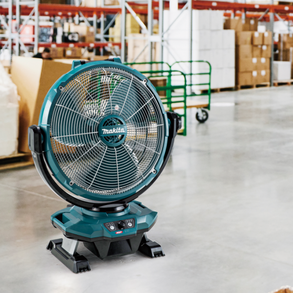 Makita CF003GZ cordless fan operating on a warehouse floor