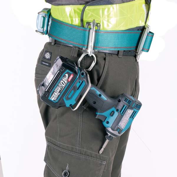 Makita TD003GA201 impact driver hung from a work belt by its belt clip